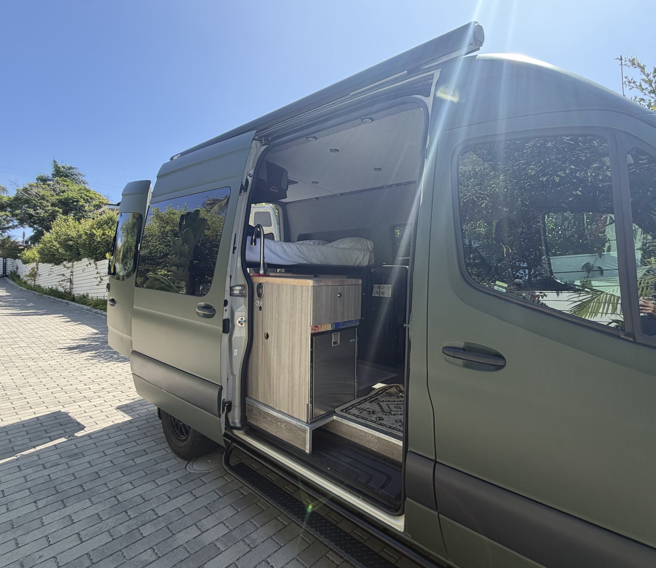 Passenger side of the Sprinter with sliding door open