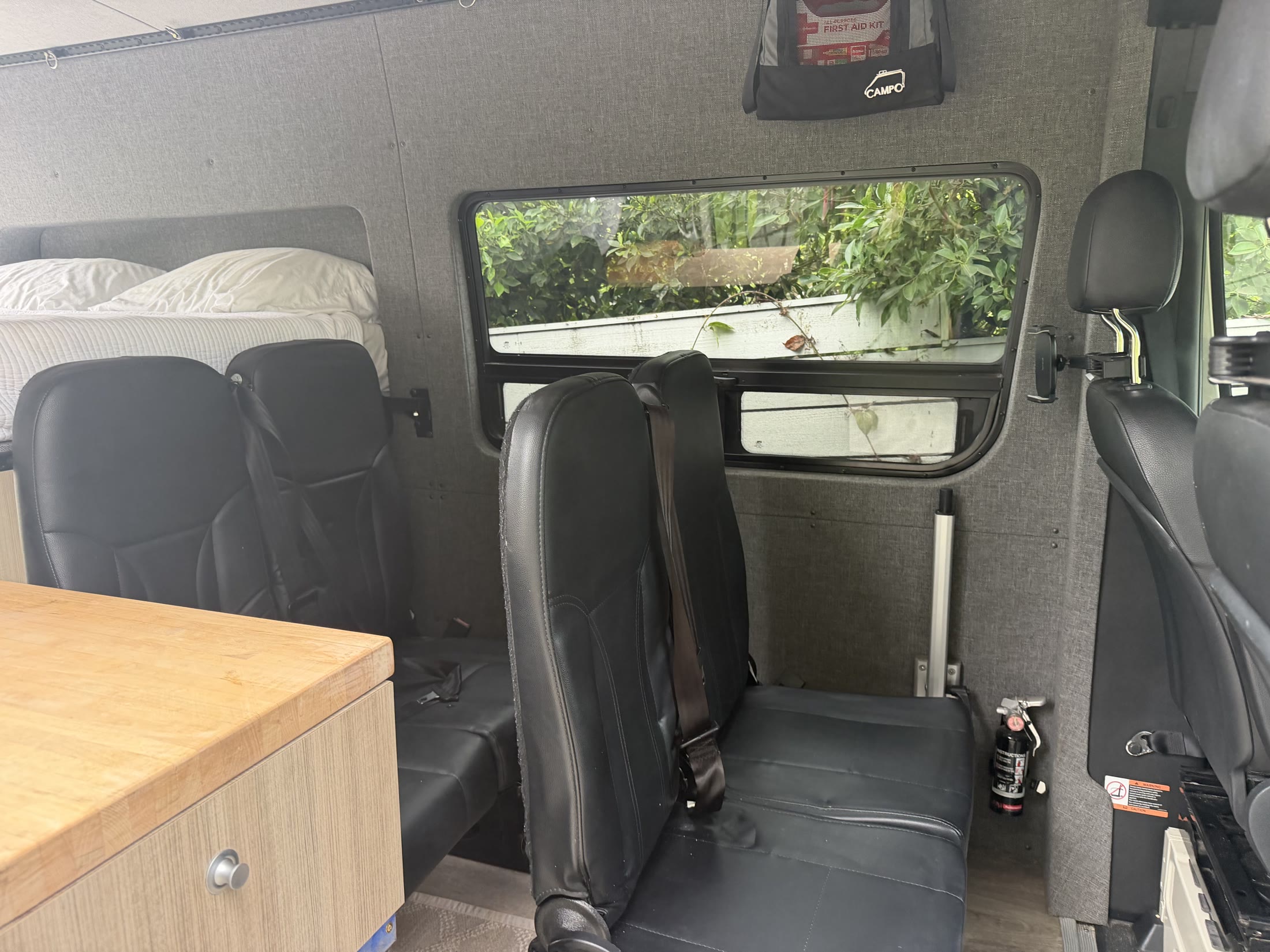 Rear passenger bench, opening window and camper cabin